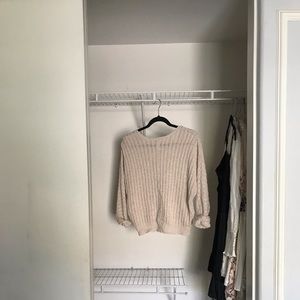 Tilly’s beige sweater